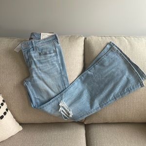 Bellbottom jeans, slightly distressed, low rise and flare